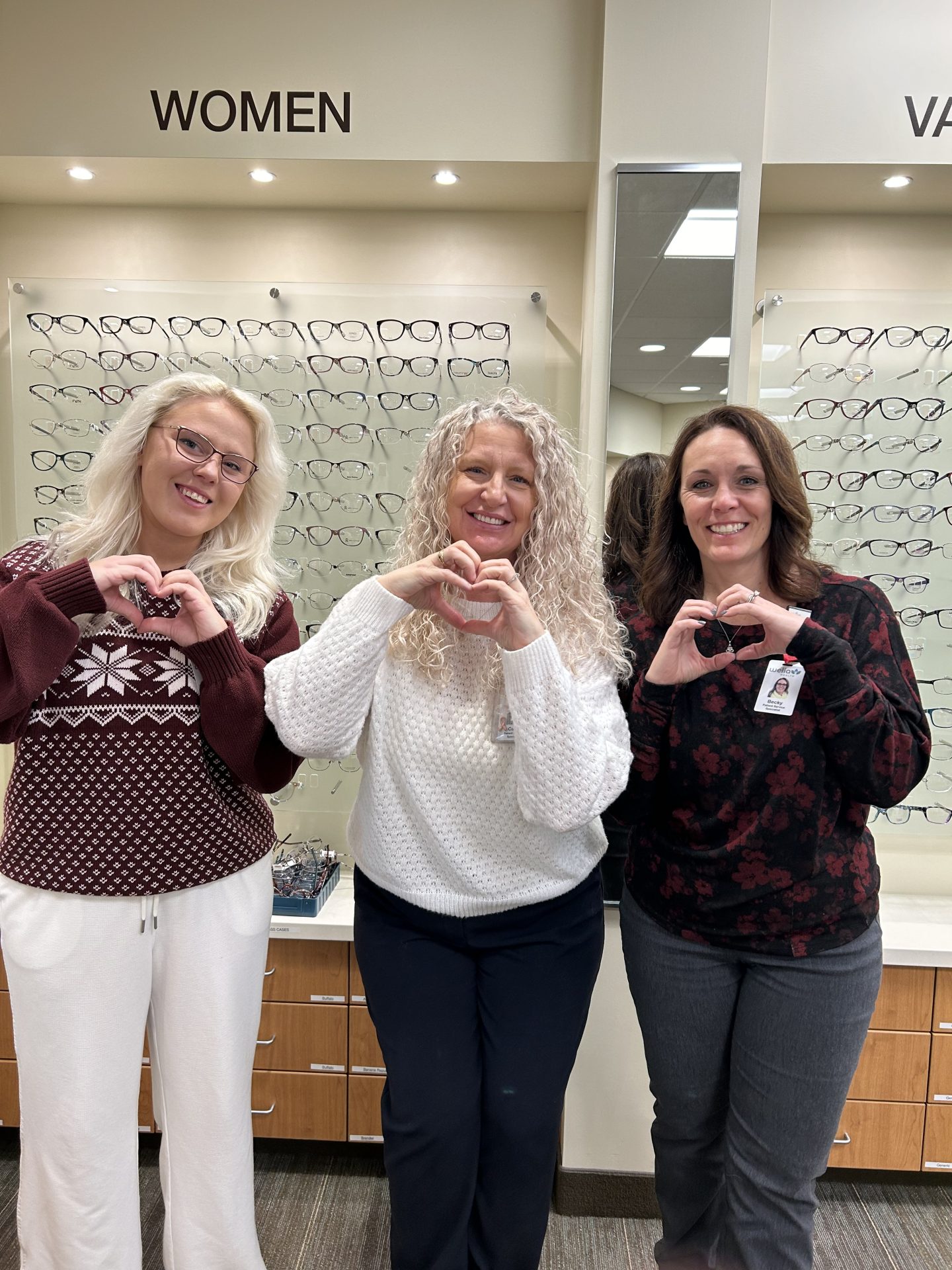 Welia Health Eye Care Center team sharing heart hands