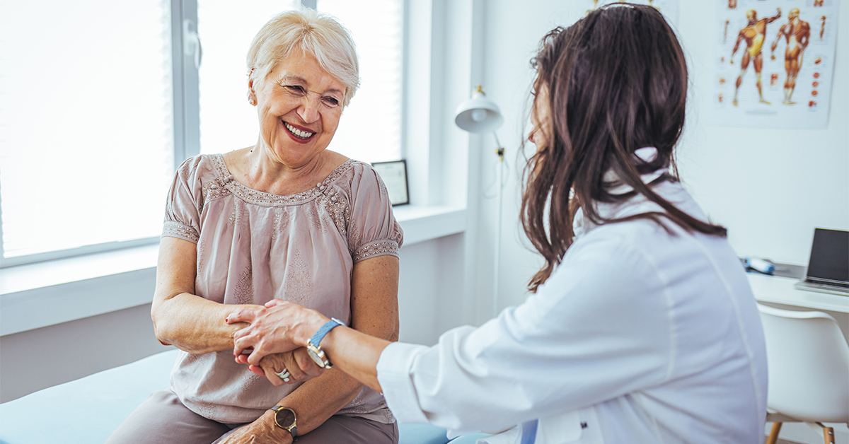 Senior female in an exam room with physician